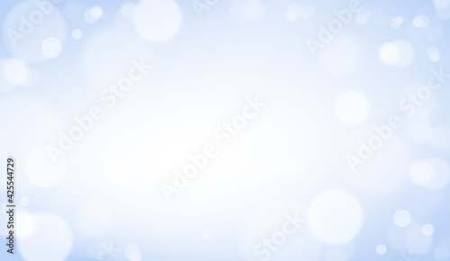 Abstract white bokeh on blue background, background design in sky blue color, sparkles and shimmery background in the shape of a circle.
