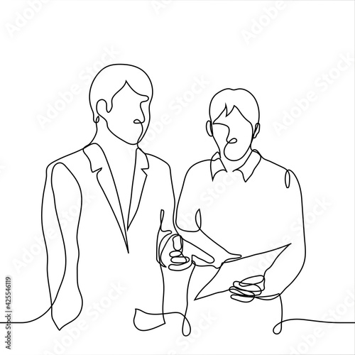 employee shows the boss the work done - one line drawing. the chief makes corrections in the report of the employee subordinate to him