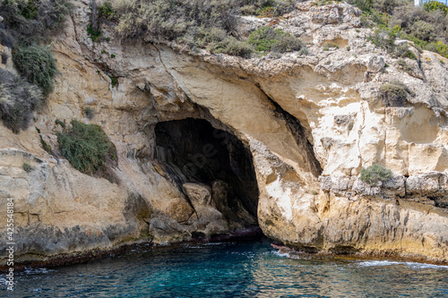 cliffs with caves in majorca, spain