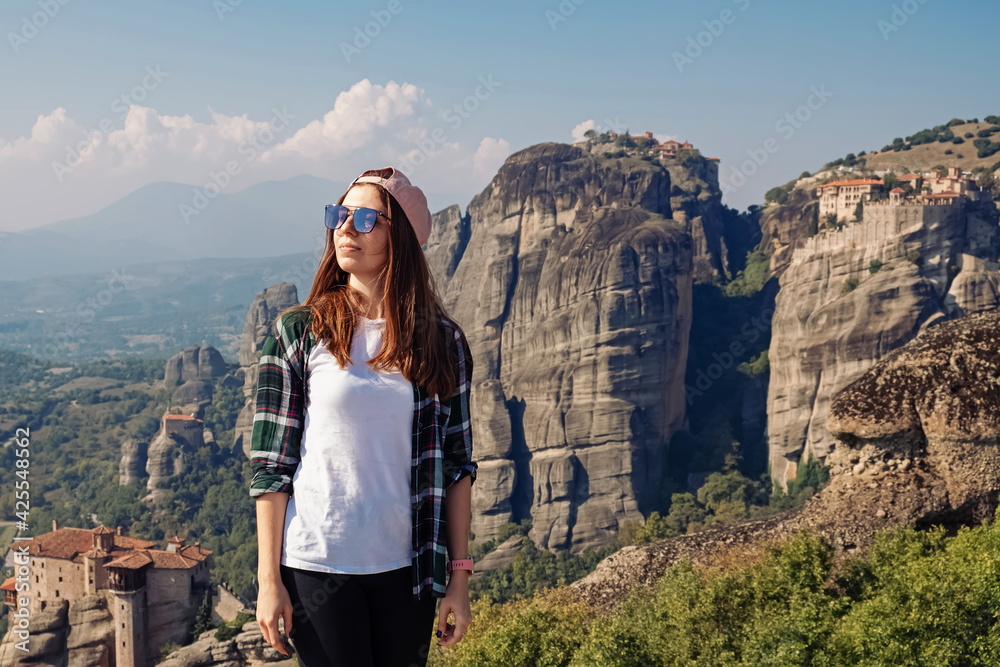 Naklejka premium Woman tourist standing with a beautiful view to Meteora , Greece