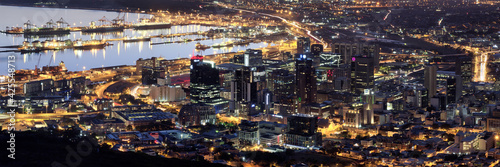 Aerial night panoramic of downtown Cape Town  harbor and Table Bay  South Africa.
