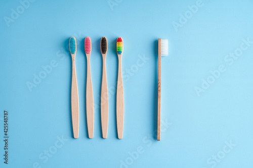 A bunch of eco-friendly bamboo toothbrushes. Global environmental trends. Gender and racial inequality. Toothbrushes of different genders © Kate
