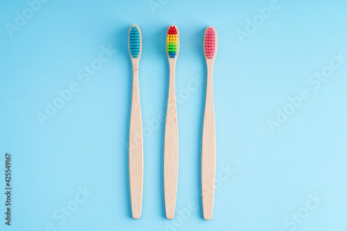 A bunch of eco-friendly bamboo toothbrushes. Global environmental trends. Gender and racial inequality. Toothbrushes of different genders