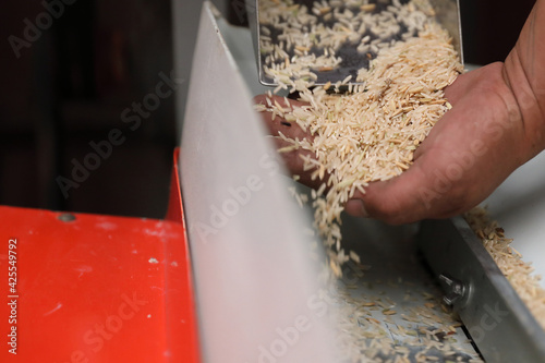 Factory machine Milling rice in close up