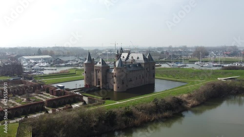 Castle Muiderslot in Muiden, the Netherlands, Aerial shot backwards photo