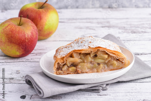 Apfelstrudel - piece of traditional handmade apple strudel photo