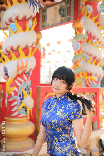 Wallpaper Mural beauty woman wear blue cheongsam looking and smile in chinese new year Torontodigital.ca