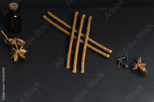 Fototapeta Naklejka Na Ścianę i Meble -  Essential oils and incense sticks for mind and body fulfilment. A minimal vintage background for apothecary and aromatherapy studio. 