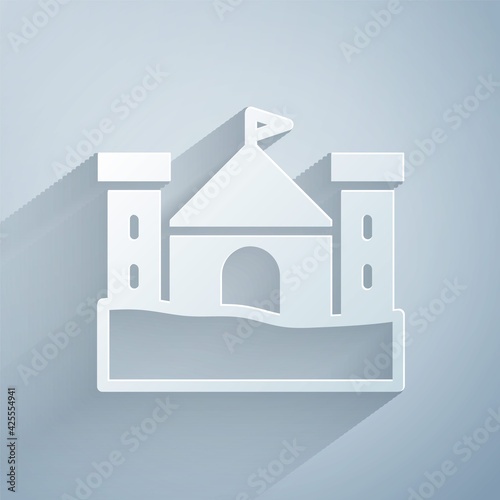 Paper cut Sand castle icon isolated on grey background. Paper art style. Vector