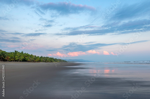 Beautiful sunset sky on the beach in Matapalo, Costa Rica. Central America. Sky background on sunset. Tropical sea. photo