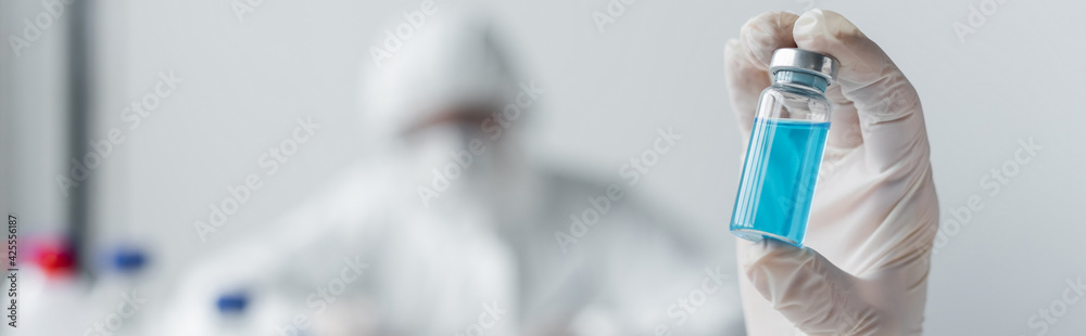 Jar with vaccine in hand of scientist, banner Jar with vaccine in hand of scientist, banner