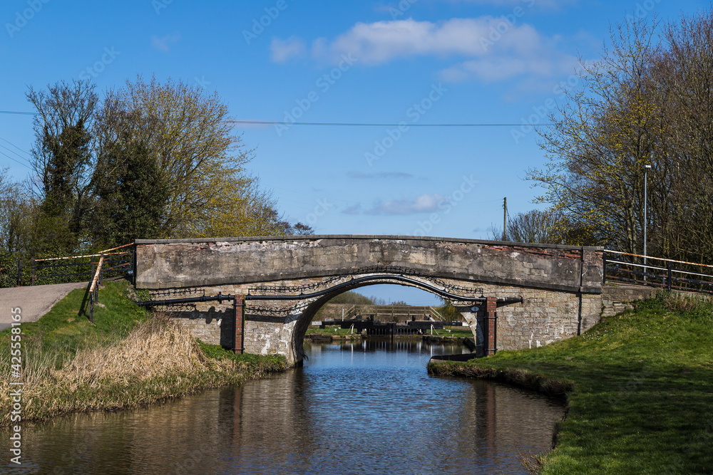 Canal lock seen through a bridge