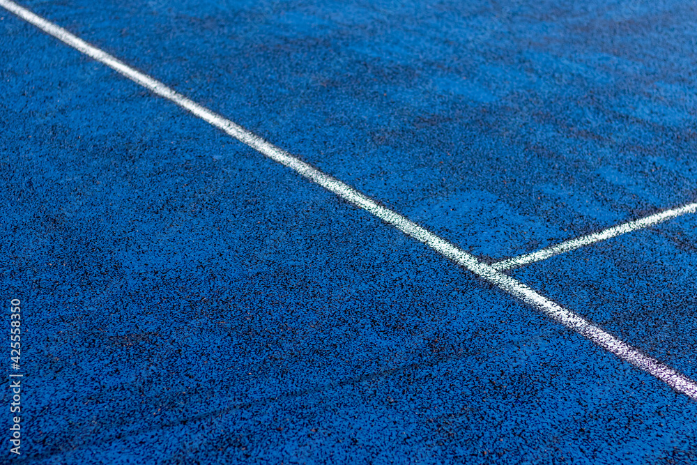White lines on a blue court