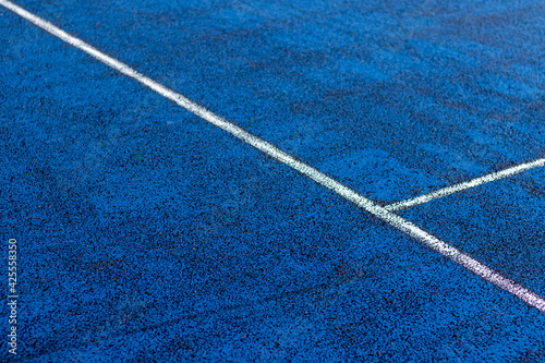 White lines on a blue court
