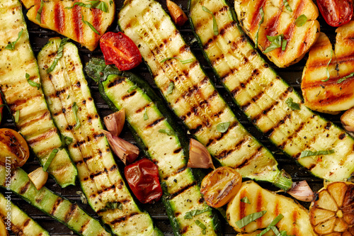 Grilled zucchini and halloumi cheese sprinkled with fresh herbs close up view. Healthy Vegetarian Food