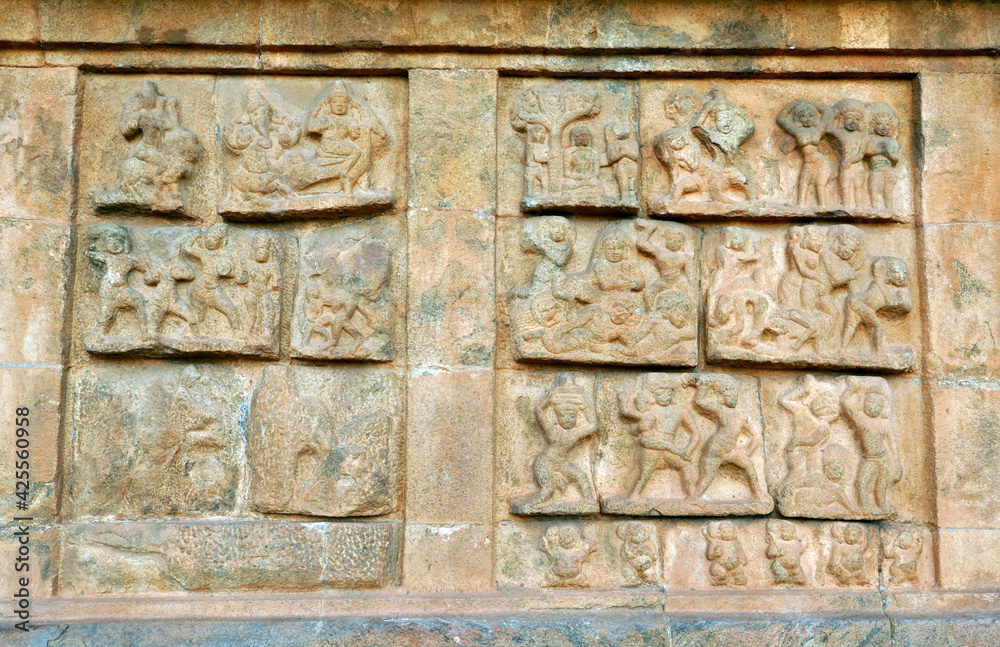 Bas relief ancient sculptures carved on the walls of historical Brihadeeswarar temple in Thanjavur, Tamilnadu. Indian rock art relief carvings of ancient God sculptures in temple walls in Tamilnadu.