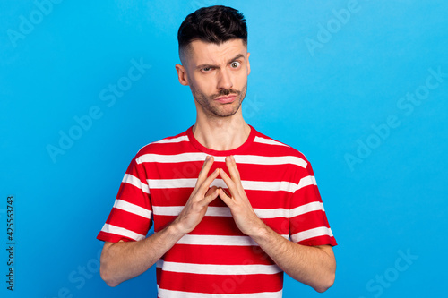 Photography Photo of evil charming young man hold hands fingers together sneaky plan isolate