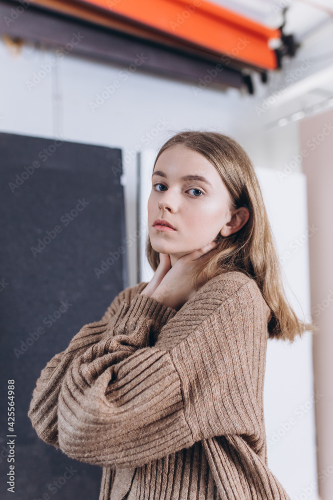 Portrait of young emotional blond caucasian girl in studio on background. Natural beauty, no make up concept Portrait of young emotional blond caucasian girl in studio on background. Natural beauty, no make up concept