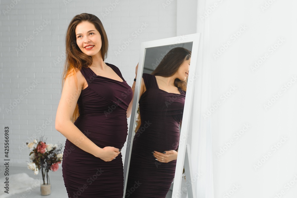 Happy pregnant young woman waiting for a child Happy pregnant young woman waiting for a child