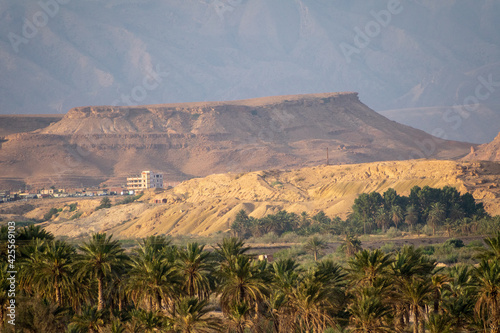 Scenic views of palm tree oasis  old building  mountains and sunsets  from El Gantera  Biskra