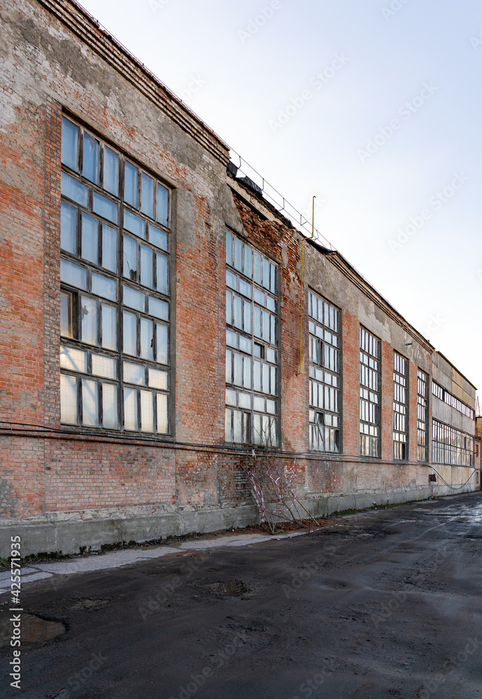 Old crumbling factory building, wall collapse danger Old crumbling factory building, wall collapse danger