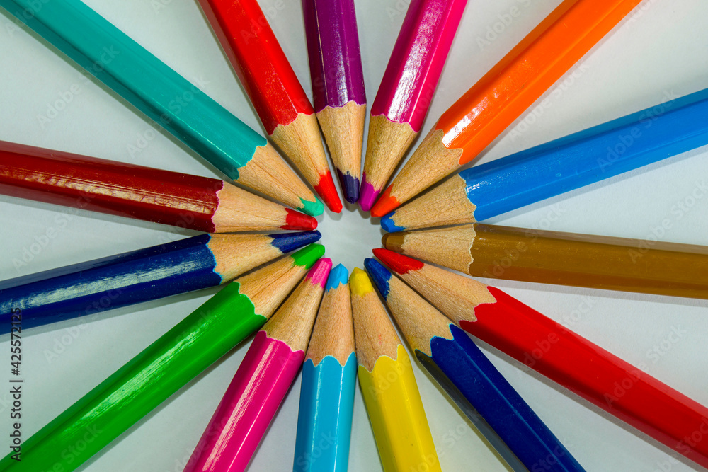 set of colored pencils on a white background. group work. pencils lie in a circle set of colored pencils on a white background. group work. pencils lie in a circle