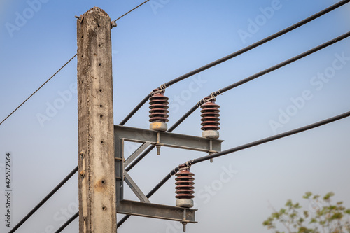 Close-up of electric poles and Electrical insulator sky background.