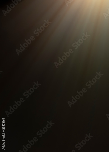 
flare of light on a black background. abstract spotlight background