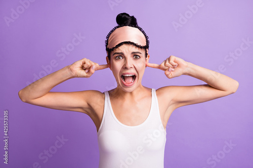 Photo portrait of angry girl shut ears with fingers screaming ignoring irritated isolated on pastel purple color background