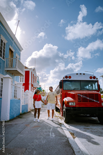 Curacao, colorful bouldings around Willemstad Punda and Otrobanda Pietermaai district, multicolored homes in Pietermaai Curacao Caribean Island , couple men and woman on vacation Curacao photo