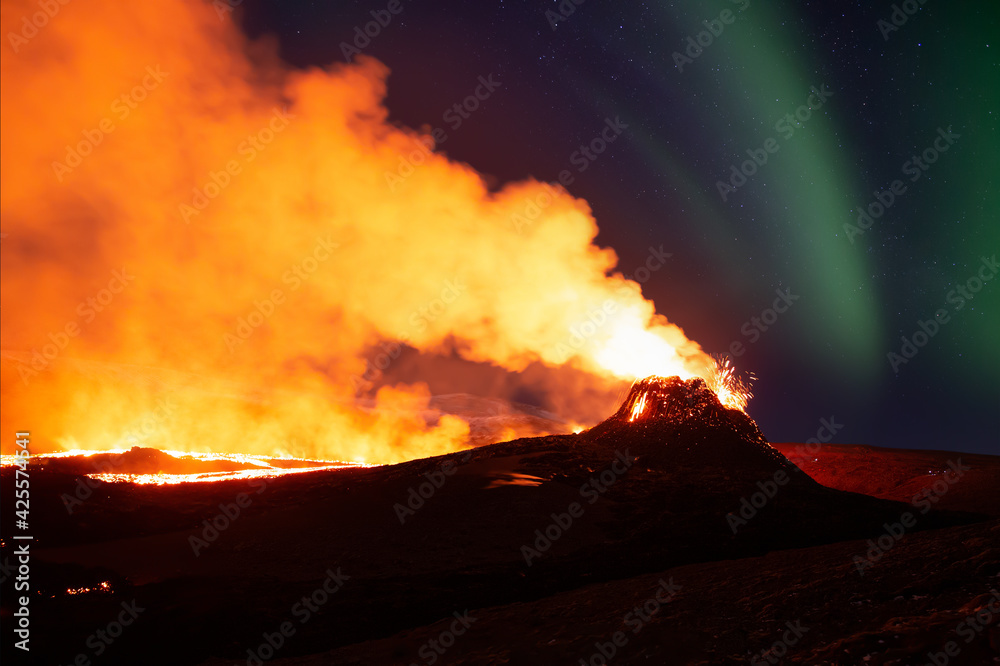 Aurora Borealis over erupting volcano in Geldingadal Iceland