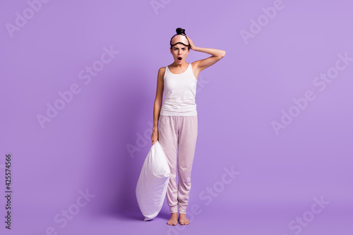 Full length body size photo of girl in sleeping mask keeping pillow overslept meeting late isolated pastel purple color background