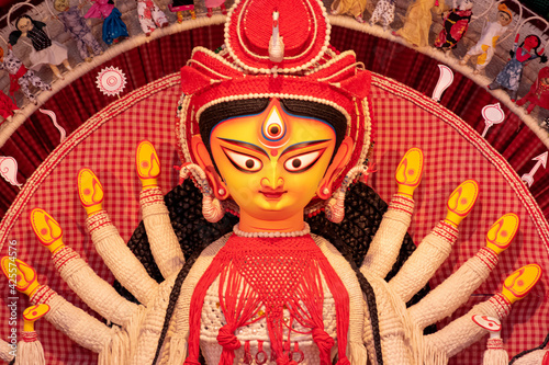 Idol of Goddess Devi Durga at a decorated puja pandal in Kolkata, West Bengal, India. Durga Puja is a famous and major religious festival of Hinduism that is celebrated throughout the world. photo