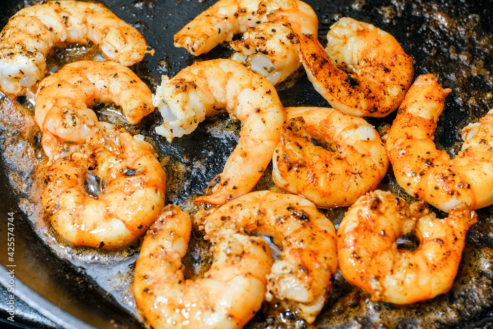 Shrimp buttered in a cast iron skillet Shrimp buttered in a cast iron skillet