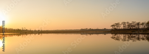 Panoramic view of sunrise over the lake in nation park, Thailand