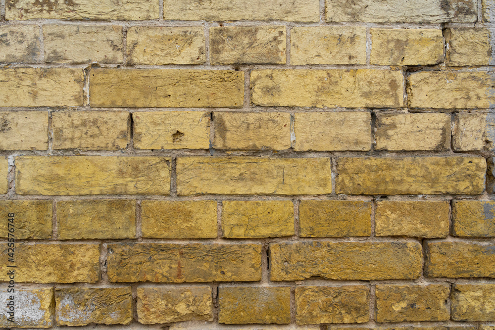 old yellow brick wall – close-up background of the. Ancient Yellow brick wall background. old yellow brick wall – close-up background of the. Ancient Yellow brick wall background.