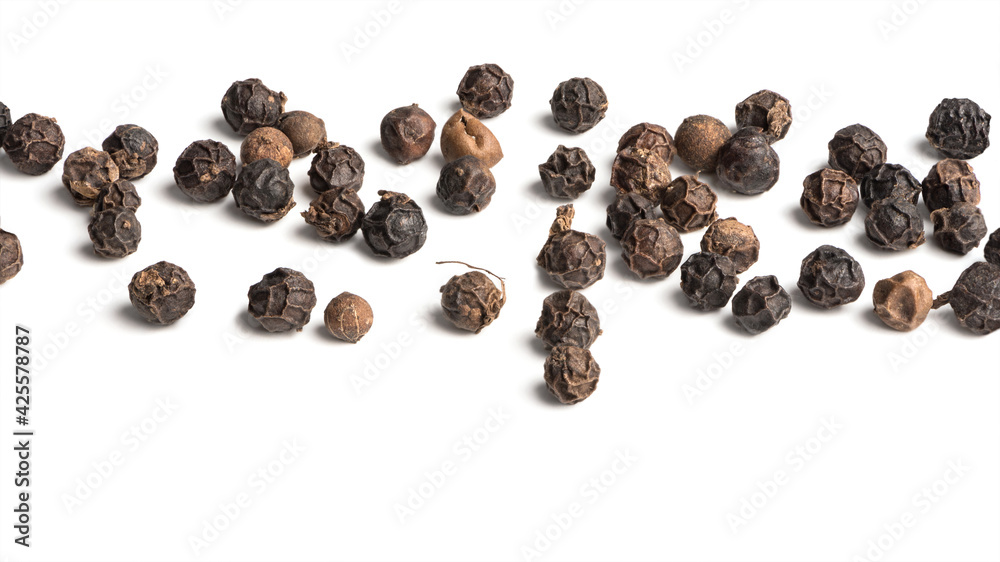 Black pepper seeds on white background Black pepper seeds on white background