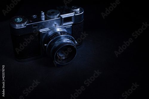 Old vintage camera closeup on darken background