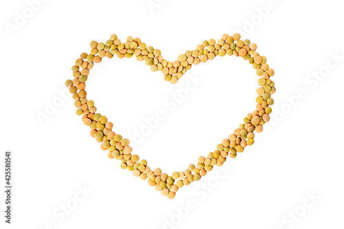 Lentil grains in heart shape isolated on white background. Groats dry brown lentils. Organic and useful for health food, vegetarian uncooked cereal. Agricultural plant harvest. Vegan meal