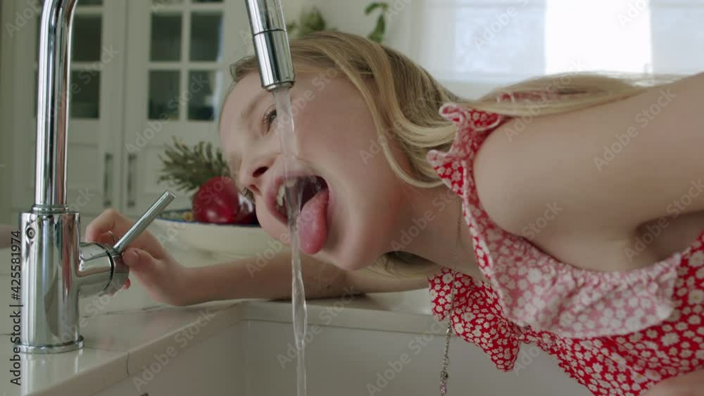 Girl tries drink tap water
