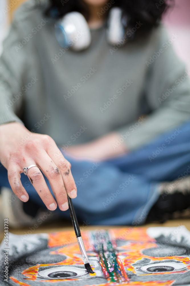 Cropped image of unrecognizable art student making a work. Selective focus. Space for text.