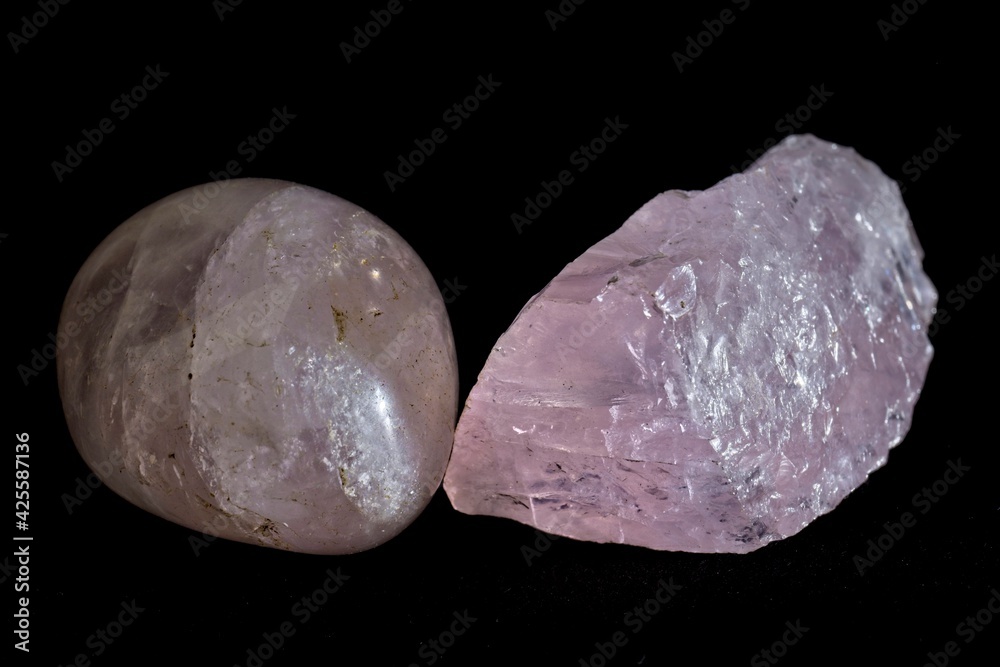 Pink healing crystals on a black background