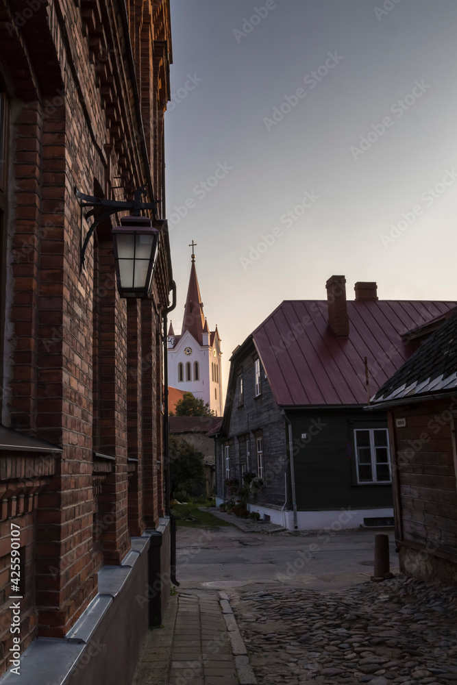 Empty cobblestone streets and church tower in the small town of Cesis.