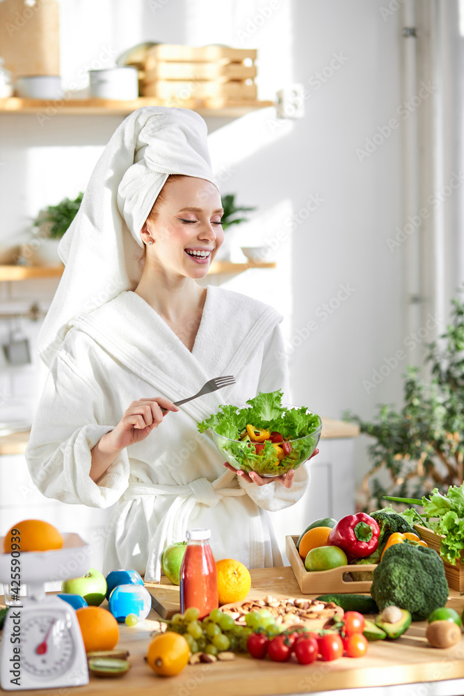 Diet. Dieting Concept. Young attractive woman preparing mixing vegetable salad in kitchen Diet. Dieting Concept. Young attractive woman preparing mixing vegetable salad in kitchen