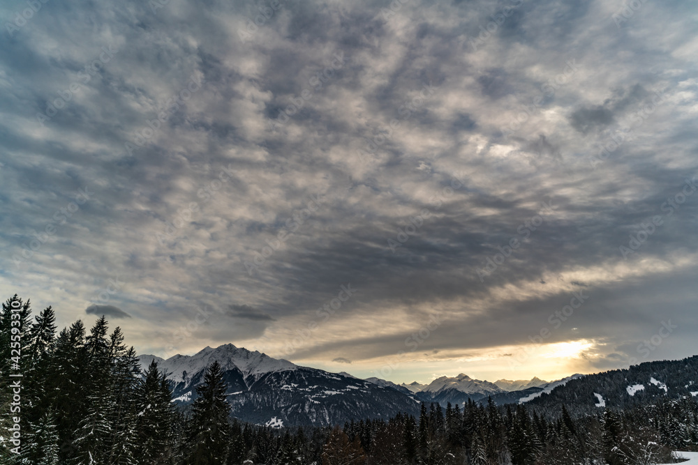 Alpine Sunset with Cloudy Sky