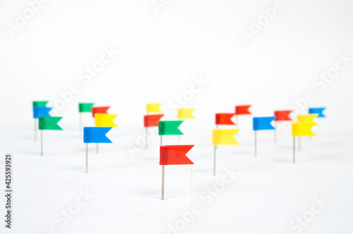 lots of colorful carnation flags on a white background isolated, side view.