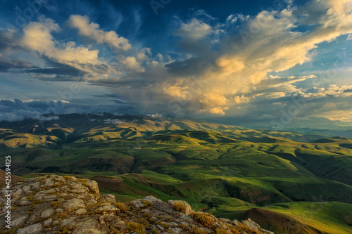 Sunset on hills in Caucasus mountains