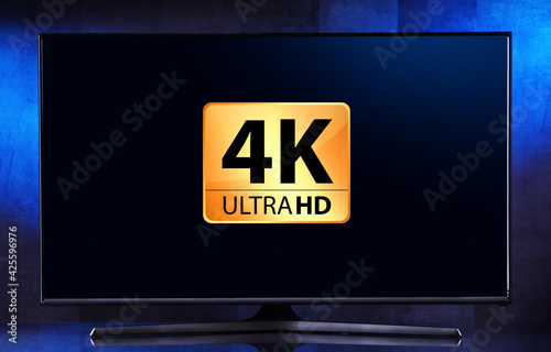 A flat-screen TV set displaying a 4K Ultra HD icon photo