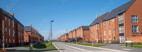 Winchester, Hampshire, England,UK. 2021.  New build homes against a blue sky in Winchester, England, UK