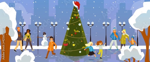 Happy people ice skating on skating rink with decorated christmas fir tree